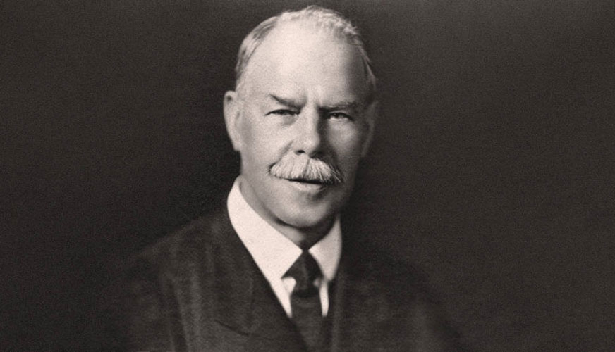 a vintage black and white portrait of Smith Wigglesworth on a dark background